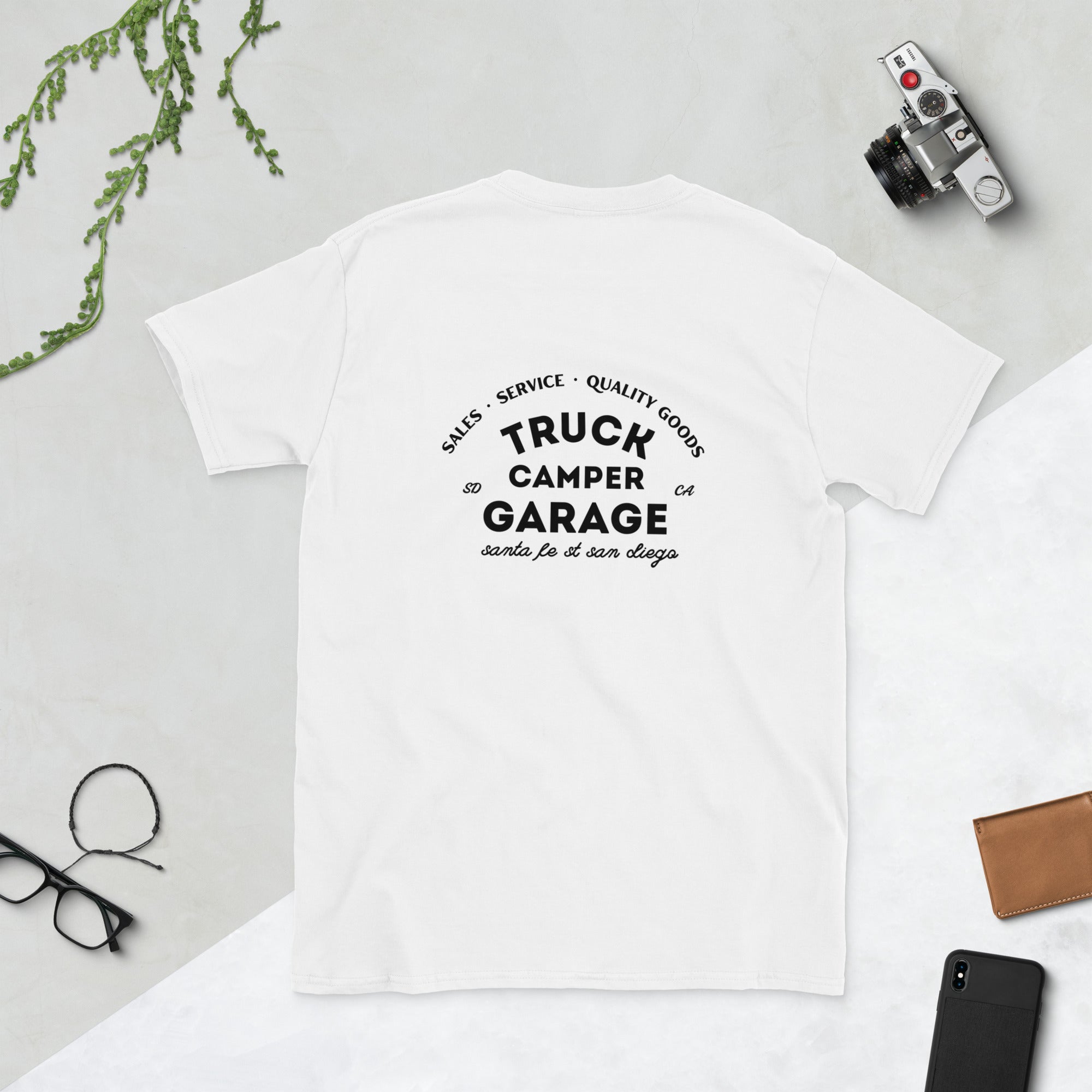 Back of white t-shirt with sales service quality goods, truck camper garage, santa fe street san diego written on it in black