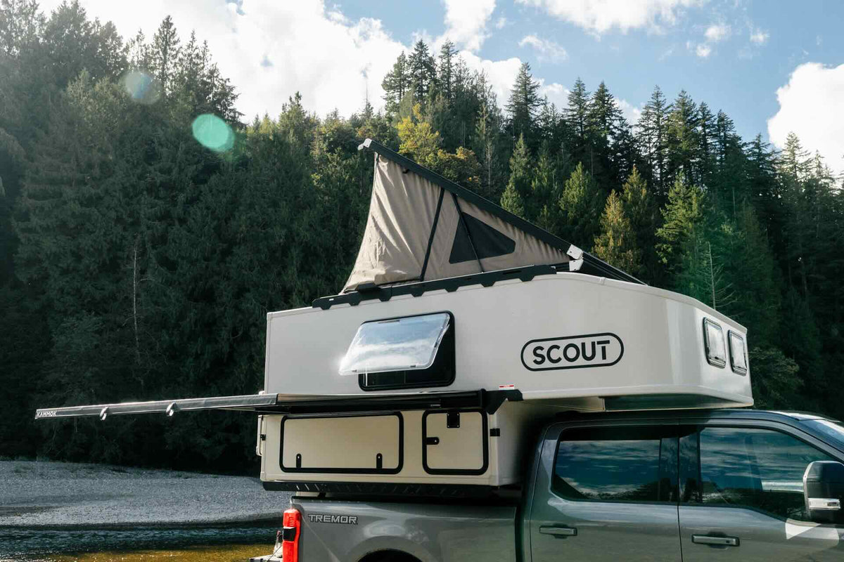 Scout Kenai hard wall truck camper at camp