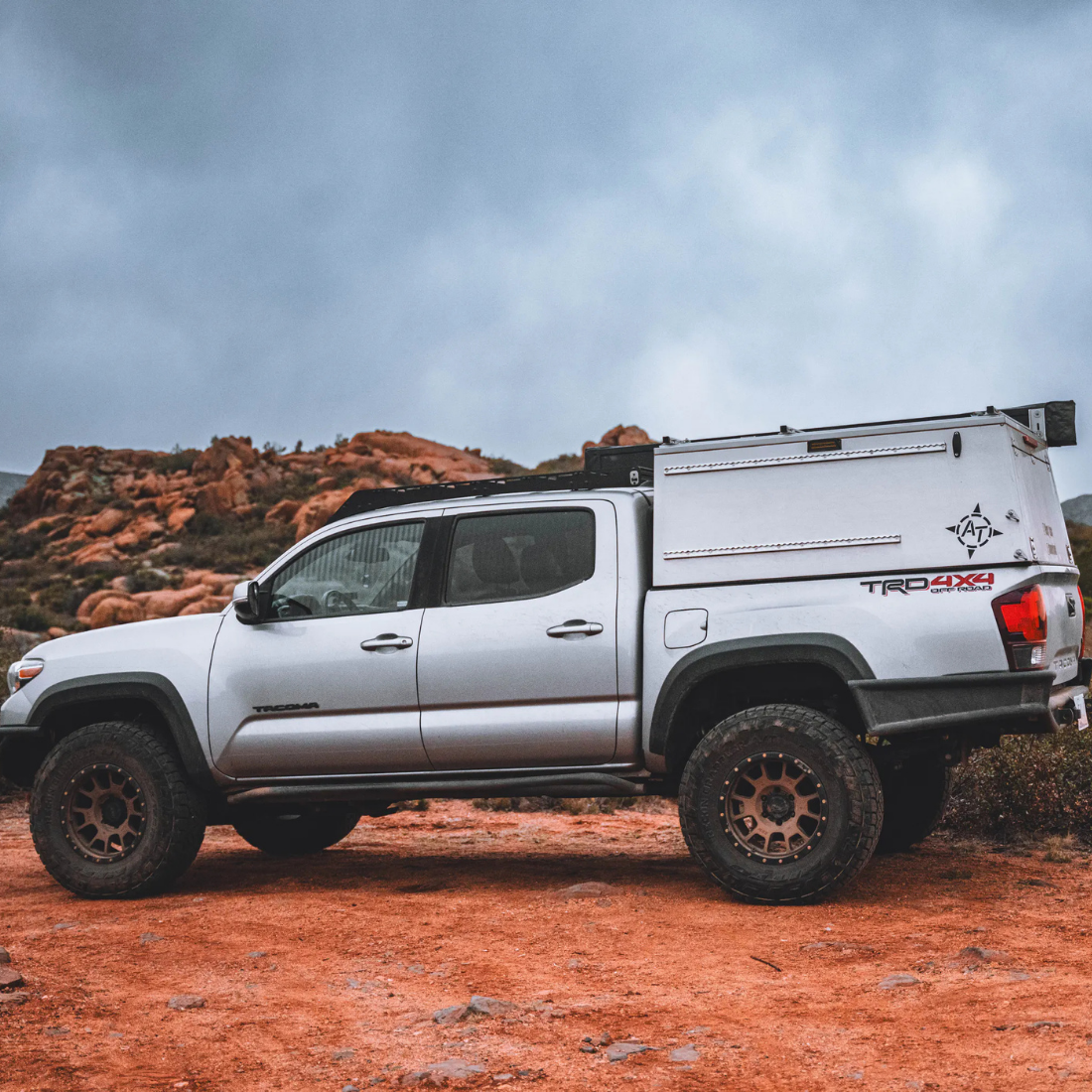 Pickup truck fitted with a hard truck cap parked in the desert